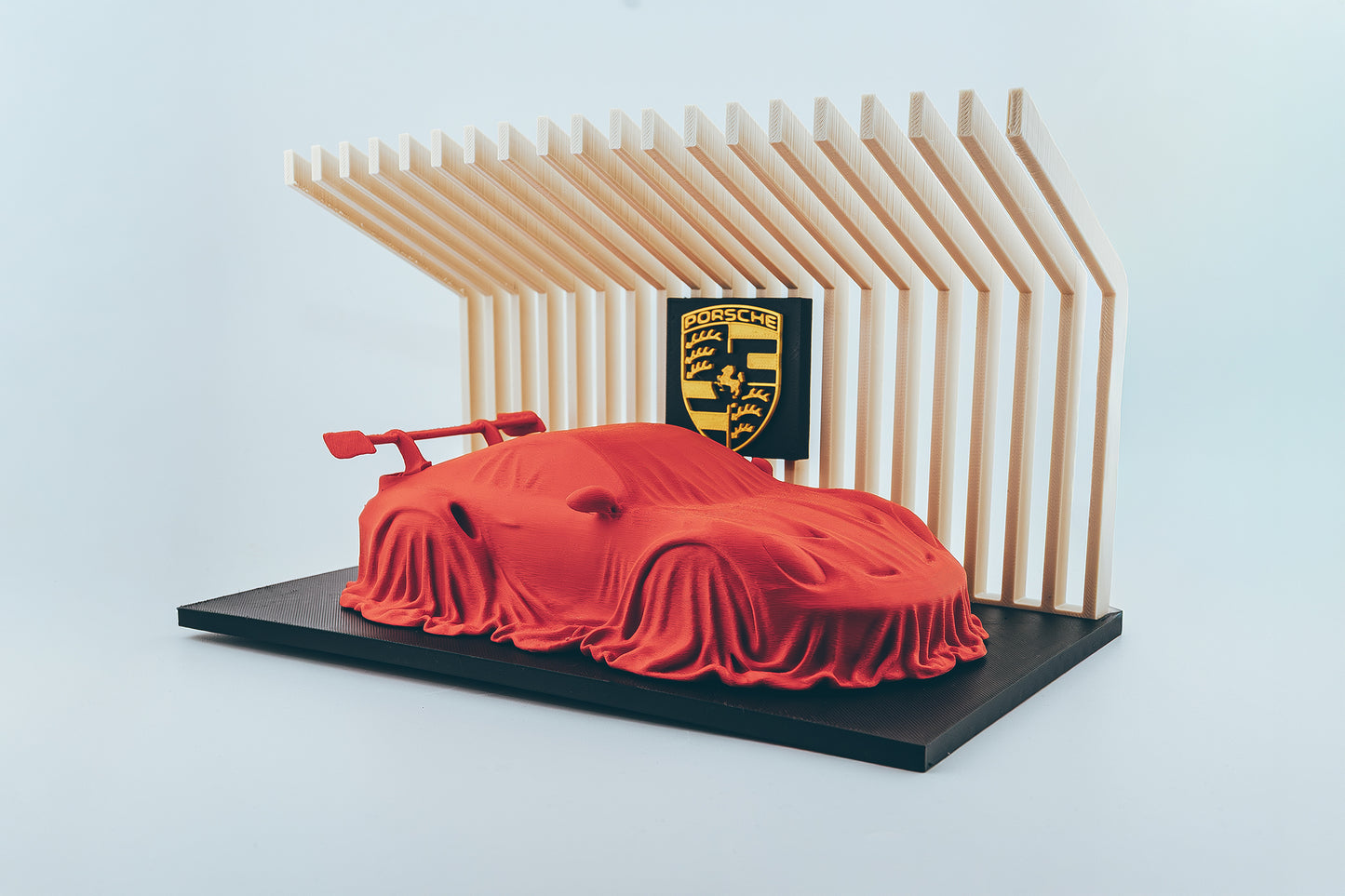 Porsche 911 GT3 RS covered on a diplay stand.